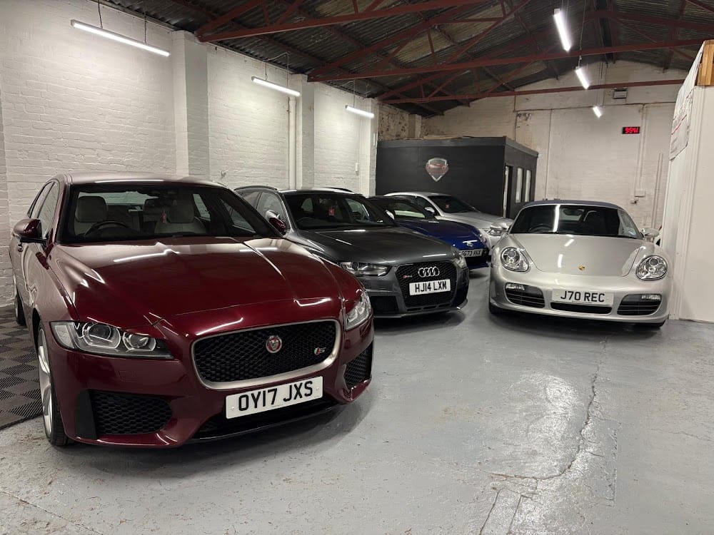 Warwickshire Specialist Cars showroom — Jaguar XF, Audi RS, Porsche Cayman